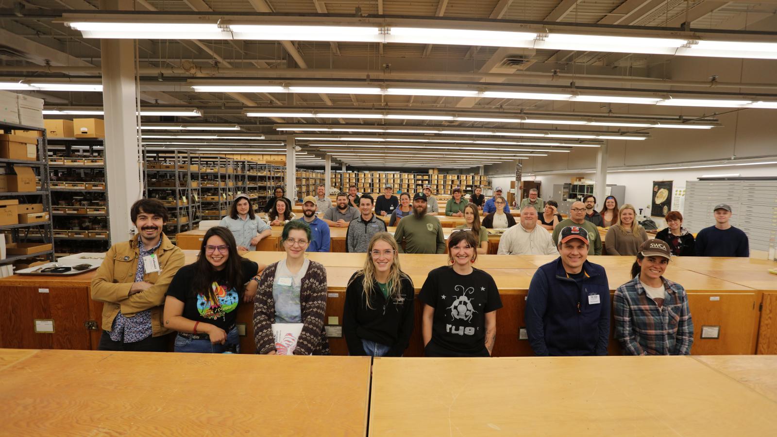 A group of participants in the 2023 mussel workshop standing in the OSU MBD Mollusk Division Collection